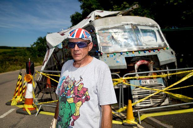 Gypsy Neil Wainwright beside his mobile home on the side of the road near Hayle